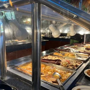 a buffet with a variety of food items