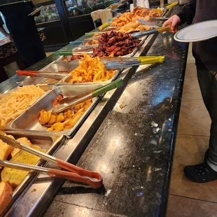 a man holding a plate of food