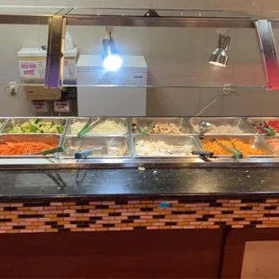 Stir fry bar options. The flat top grill is right next to it.