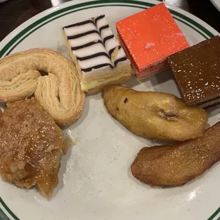 Dessert items - cookie, fried bananas, chocolate and strawberry mousse, mille-feuille