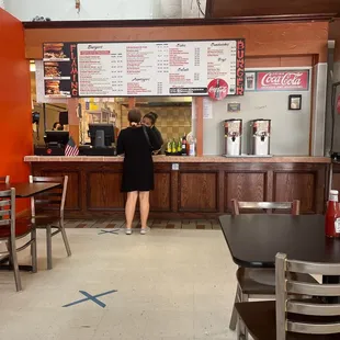 a woman standing at the counter