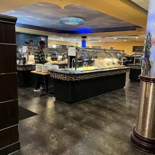 a man standing in front of the buffet