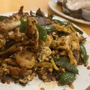 a plate of stir fried food