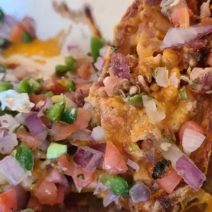 Bacon skins (but they have MANY VARIETIES. (Mine had fresh made Pico, melted cheddar cheese)