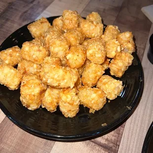 a plate of fried tater tots