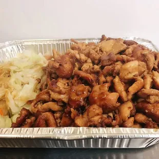 a container of chicken and cabbage