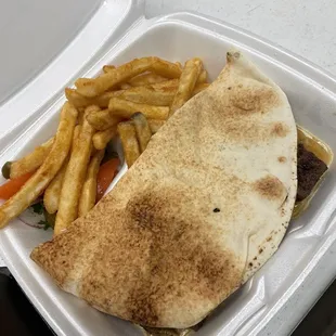 a meal in a styrofoam container