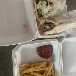 Gyros Sandwich. Meat Shawarma Sandwich and hot crispy delicious fries.