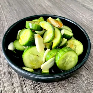 Pickled cucumber with slivered garlic, sesame oil and light chili oil fragrance.