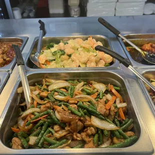 a variety of food items in a buffet