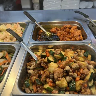 a variety of food in a buffet