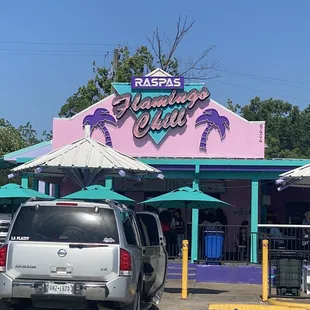 a car parked in front of a restaurant