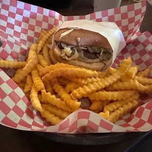 Hamburger with Swiss and french fries.