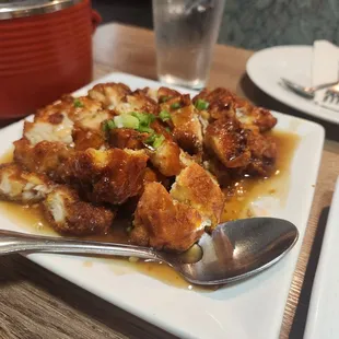 a plate of food and a glass of water