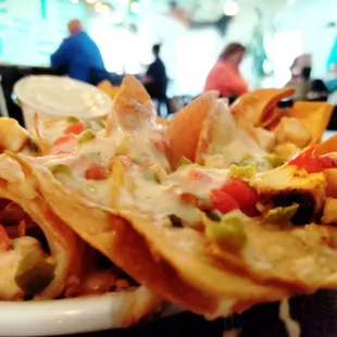a plate of nachos at a restaurant