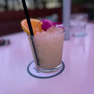 a pink table with a pink table cloth and a pink table cloth with a pink table cloth and a pink table