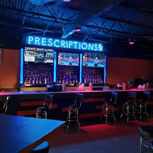 a bar with neon signs