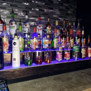 a variety of alcohol bottles on a shelf