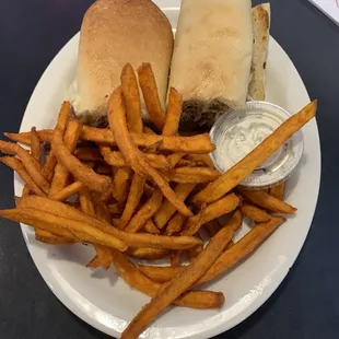 Philly cheese steak sandwich with sweet potato fries