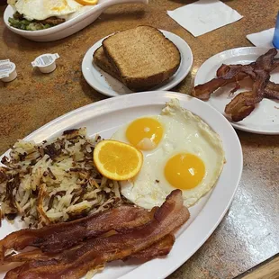 Two egg plate with extra bacon and toast