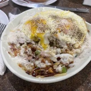 Hungry man skillet with extra gravy &amp;  over easy eggs.