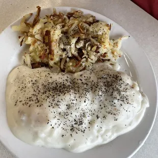 Biscuits and gravy and hash browns. Not that much pepper comes on them, I didn't beat my husband to take the photo.
