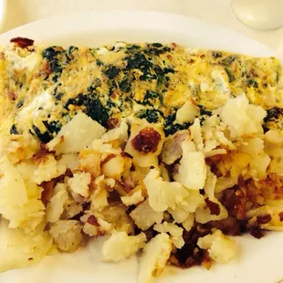 Spinich, bacon, Swiss omelette with home fries.