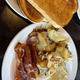 2 eggs 2 bacon.Home fries.Toast. Less than 6 bucks