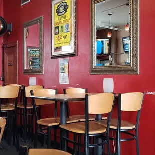 a row of tables and chairs in a restaurant