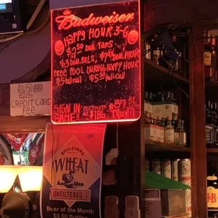 a photo of a bar with a neon sign