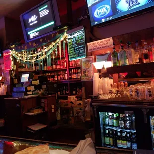 a bar with a variety of drinks