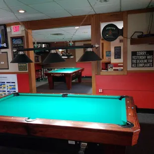 a pool table with a green cloth