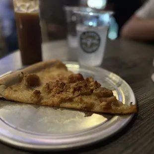 Chicken and Waffles slice with a container of glaze to super indulge the sweet tooth.