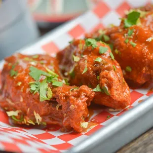 a plate of chicken wings