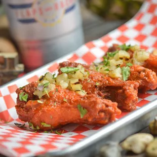 a plate of food with a drink in the background