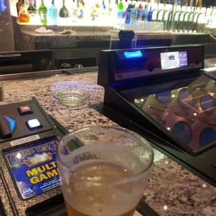 a glass of beer and a cell phone