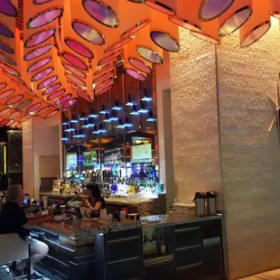 brightly lit bar and lounge area