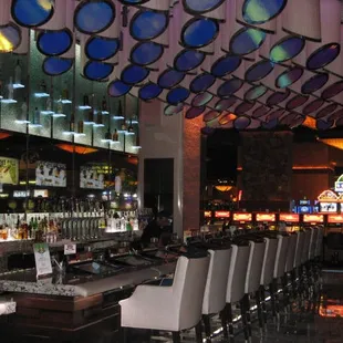 rows of bar chairs and a bar counter