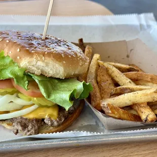 a hamburger and french fries on a tray