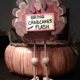 a sign that reads bring crabcakes for flash