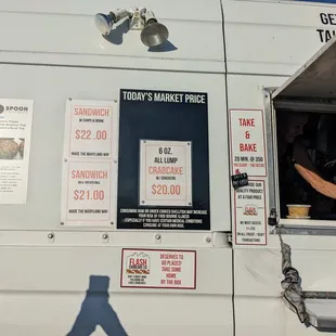 a man looking out the window of a food truck