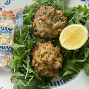 a plate of food with a lemon wedge