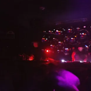 a man on a stage surrounded by people