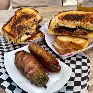 a grilled cheese sandwich and bacon wrapped peppers