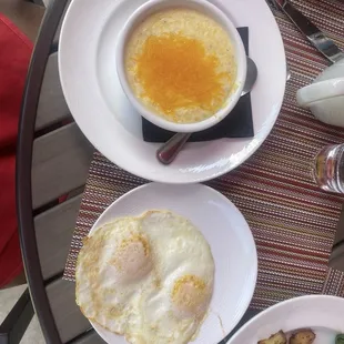 Grits with cheese and two over easy eggs