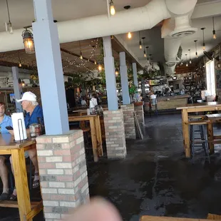 people sitting at tables in a restaurant