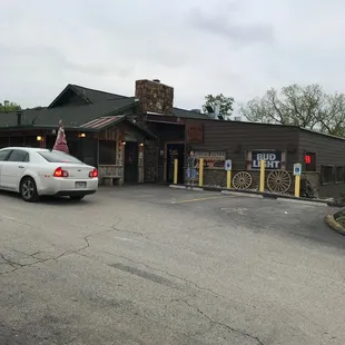a car parked in front of the restaurant