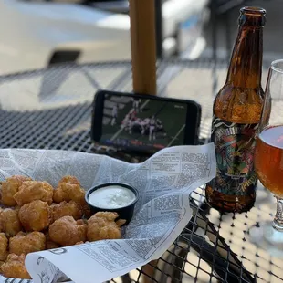 a plate of food and a glass of beer