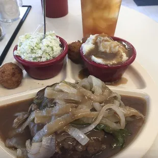 Monday special of hamburger steak, two sides, and rolls or hush puppies. $6.99