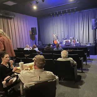 The theater offered traditional theater-style seating and small tables.